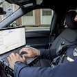 Officer using Draft One. The new Axon tool transcribes audio from the company's current body-worn cameras and uses artificial intelligence to produce a police report.