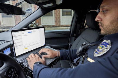 Officer using Draft One. The new Axon tool transcribes audio from the company's current body-worn cameras and uses artificial intelligence to produce a police report.