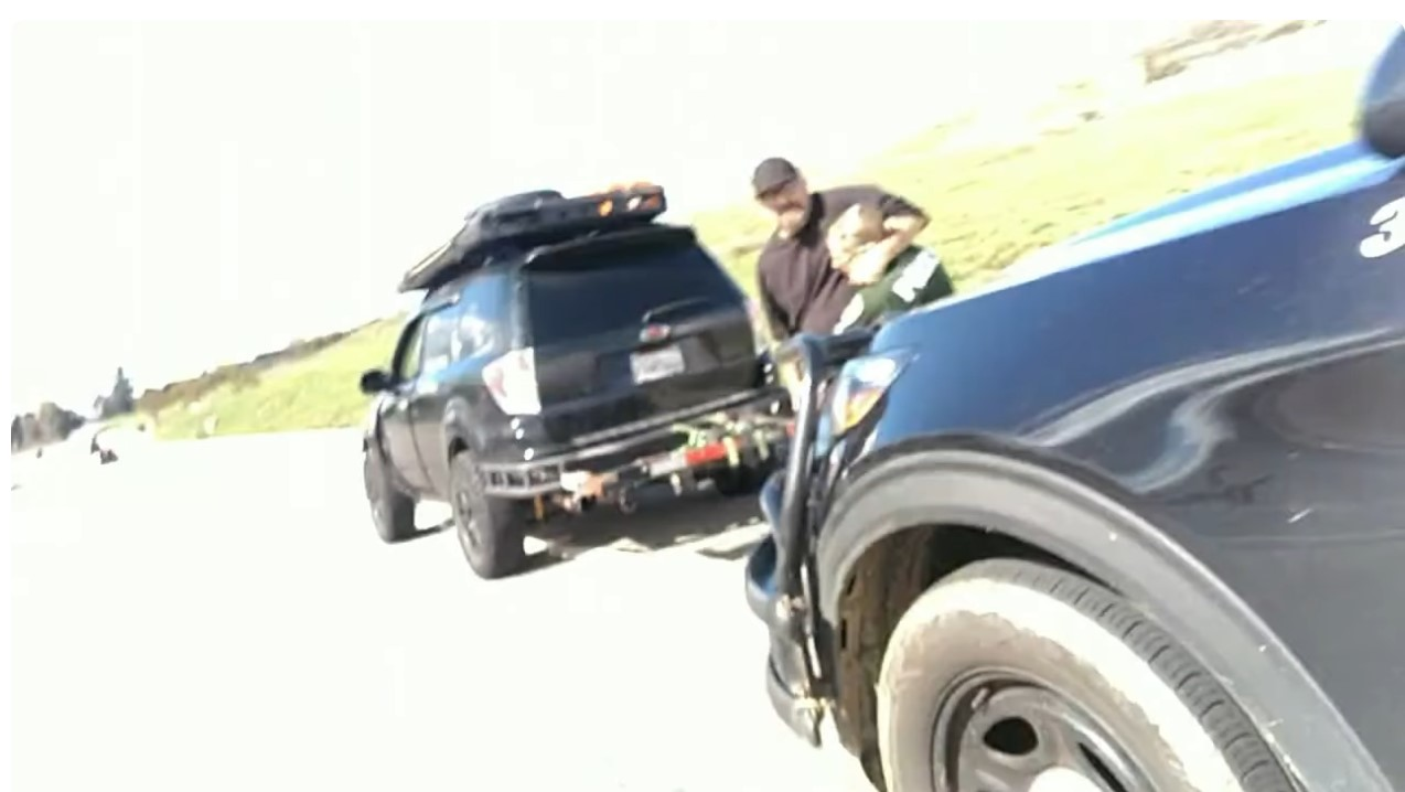 A Fontana, California, police officer under attack during a February traffic stop. The suspect was shot by another officer.