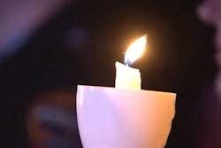 Candle glowing in the audience during the 36th Annual National Candlelight Vigil.