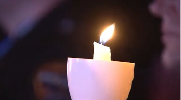 Candle glowing in the audience during the 36th Annual National Candlelight Vigil.