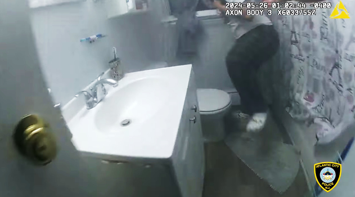 The video shows when the officer reached the teen and escorted her safely out of the burning home.