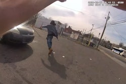 Suspect running from Charlotte-Mecklenburg Police officer with gun in hand. The suspect was shot and wounded by the officer.