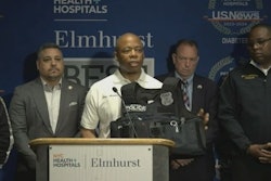 New York City Mayor Eric Adams holds body armor that stopped a bullet from seriously wounding Officer Richard Yarusso early Monday.