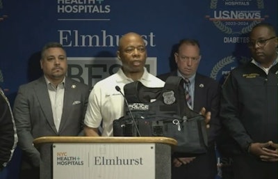 New York City Mayor Eric Adams holds body armor that stopped a bullet from seriously wounding Officer Richard Yarusso early Monday.