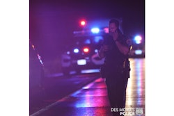 Des Moines Police officer at the scene of a gunfight between officers and a fleeing suspect.