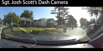 Oklahoma City Police officer under fire and returning fire before July 2 standoff.