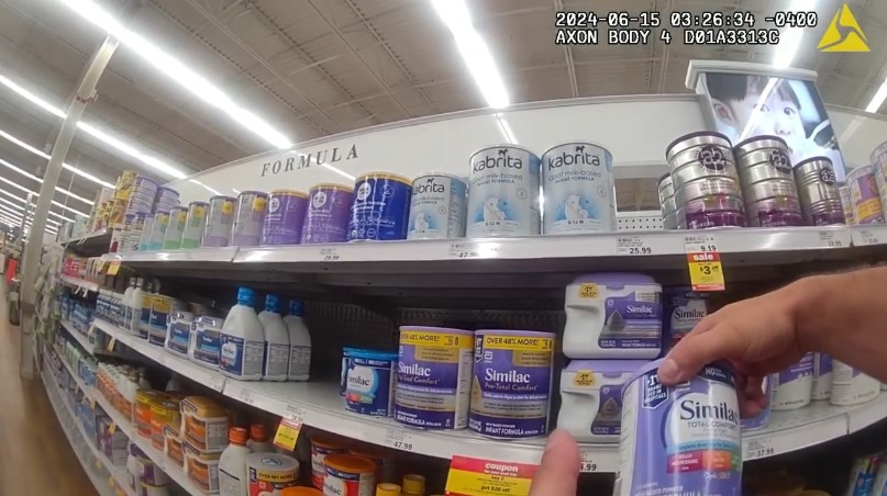 Corporal Hunter Willougby of the Miami Township (Ohio) Police Department shops for formula to help a desperate mother feed her newborn.