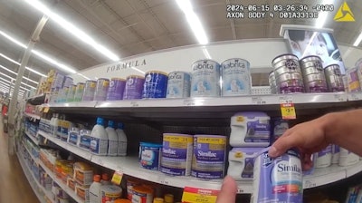 Corporal Hunter Willougby of the Miami Township (Ohio) Police Department shops for formula to help a desperate mother feed her newborn.