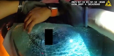 Colony, Texas, Police Officer Edwardo Hernandez pulls an injured driver from a burning Tesla.
