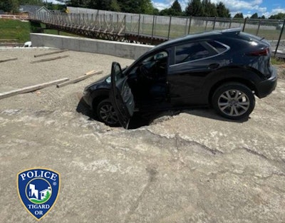 An Oregon bank robbery suspect tried to escape a police pursuit by driving through a construction site and crashed into a hole.