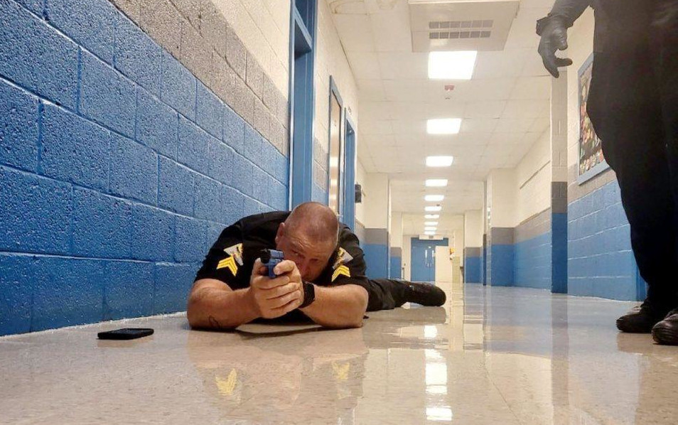 Sgt. Daniel Porché, of the Madison County Sheriff’s Office in North Carolina, trains inside a school with other school resource officers.