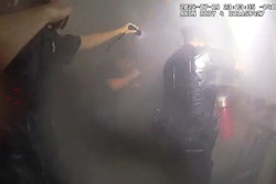 NYPD officers discharge a fire extinguisher in an apartment building after rescuing a woman from her apartment. The department this week released body-worn camera video of the rescue.