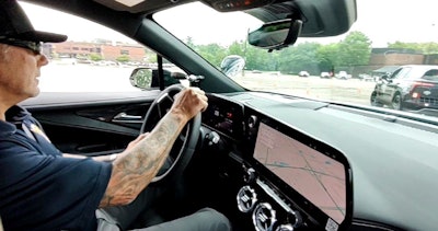 Retired Sgt. Brian Donnelly of the California High Patrol pushes the electric SUV hard through a cones course.
