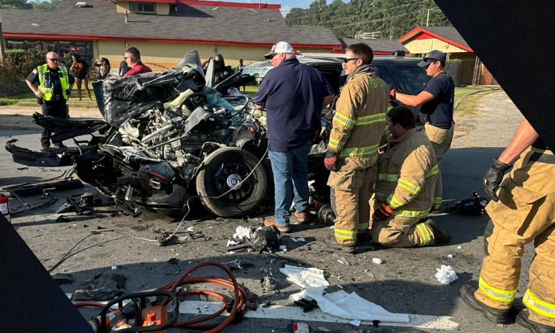 When a Pine Bluff officer’s car slammed into the stopped school bus, flames burst out with the officer trapped in the wreckage. He was saved by the bus driver with a fire extinguisher.
