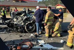When a Pine Bluff officer’s car slammed into the stopped school bus, flames burst out with the officer trapped in the wreckage. He was saved by the bus driver with a fire extinguisher.