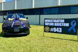 Investigator Taylor Bristow's police vehicle has been set up as a memorial outside the headquarters of the Carroll County Sheriff's Office.