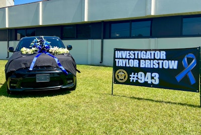 Investigator Taylor Bristow's police vehicle has been set up as a memorial outside the headquarters of the Carroll County Sheriff's Office.