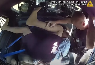 Now fired Joneboro, Arkansas, Police Officer Joseph Harris is shown with detainee Billy Lee Coram. Officials say the fired officer abused the suspect.