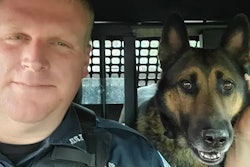 Erwin (Tennessee) Police K-9 Scotty with his handler. Scotty was killed Friday in a Hurricane Helene flash flood.