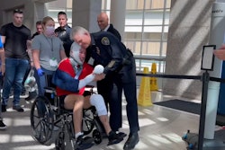 San Diego Police Officer Zachary Martinez is greeted by fellow officers as he goes home from the hospital. Martinez was severely injured and his partner was killed in a pursuit crash last week.