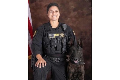 K-9 Specialist Samantha Ramirez of the Richland County Sheriff's Department with K-9 Kodak. Kodak died Thursday from injuries he suffered in a tracking operation last week.