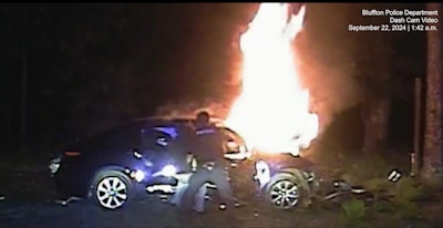 Staff Sgt. Brian Kaase of the Beaufort County (South Carolina) Sheriff’s Office and Officer Azahel Young of the Bluffton Police Department rescue a man from a burning sedan.