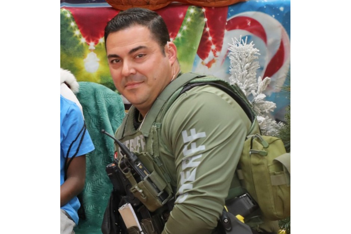 Cpl. Elio Diaz at this year's Shop With A Cop program. It was 'an event for which he eagerly signed up each year. His love for his career, the people he served, and the people he served beside was unparallelled,' the sheriff's office said.