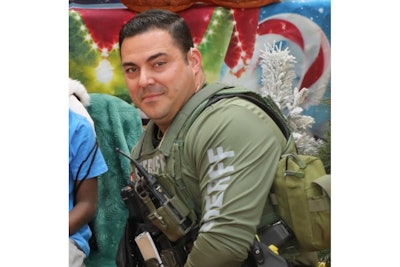 Cpl. Elio Diaz at this year's Shop With A Cop program. It was 'an event for which he eagerly signed up each year. His love for his career, the people he served, and the people he served beside was unparallelled,' the sheriff's office said.