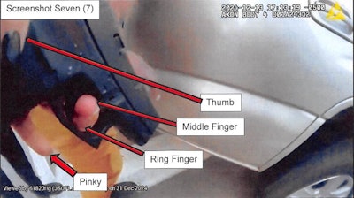 Image from Jacksonville Sheriff's Office Internal Affairs report shows officer's finger inside the trigger guard before the accidental discharge.