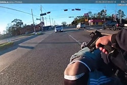 Houston officer points pistol at man during gun grab attack on fellow officer just before a Jan. 6 fatal shooting.