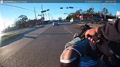 Houston officer points pistol at man during gun grab attack on fellow officer just before a Jan. 6 fatal shooting.