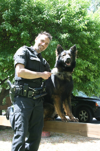 Michael W. Kmiecik II, owner of owner, consultant and trainer for Sheepdog Guardian Consulting LLC, was a police K-9 handler for much of his career. Here he is pictured with his police K-9, Luther.
