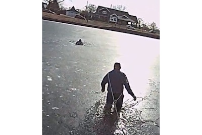 Patrolman David Brosonski of the West Long Branch (New Jersey) Police Department wades out into a frozen lake to rescue a boy.