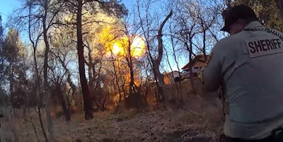 A Yavapai County (Arizona) Sheriff's deputy reacts as a suspect detonates a propane tank at the end of a vehicle pursuit.