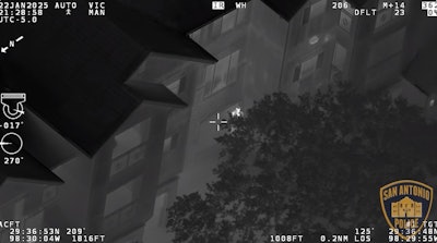 Still from San Antonio Police video show suspect pointing gun at police helicopter.