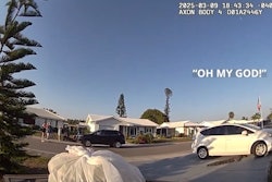 Body camera view of alligator in Bradenton, Florida, driveway as Bradenton Police officer delivers pizza to resident.