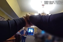 Still from body camera video shows St. Charles, Illinois, Police officer deploying his TASER on a chainsaw wielding suspect inside a senior home.