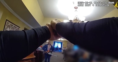 Still from body camera video shows St. Charles, Illinois, Police officer deploying his TASER on a chainsaw wielding suspect inside a senior home.