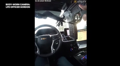 A Lawrence, Indiana, Police officer fires a rifle through his own windshield during a vehicle pursuit where the suspect opened fire on him.