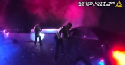 Rowlett Police Officer Issac Gorskikh pulls a man from a burning vehicle that just hit his patrol unit.