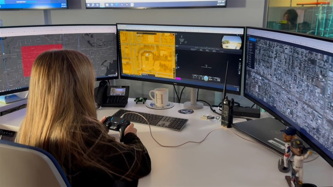 A drone as first responder pilot operates a drone from the Arlington (Texas) Police Department's real-time crime center.