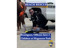 Officer Billy Crocker of the Jacksonville Sheriff's Office works to resuscitate a child who was drowning at a local beach Saturday.