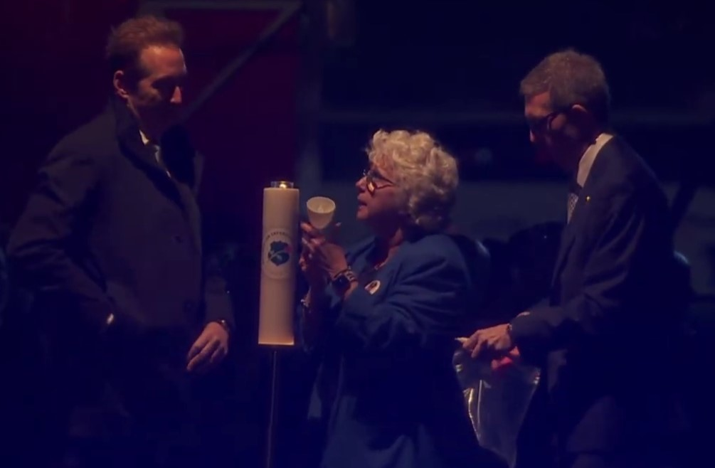 Deputy Secretary of Homeland Security Troy Edgar, Connie Moyer of Concerns of Police Survivors, and National Law Enforcement Officers Memorial Fund CEO Bill Alexander light the first candle at the 2025 Candlelight Vigil.